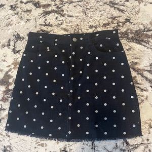 Black and white polka dot skirt.